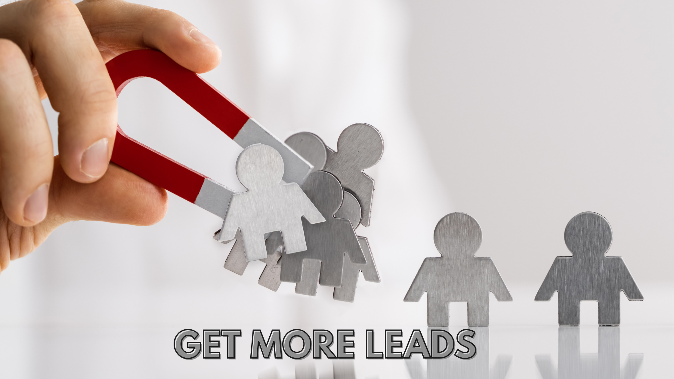 An image that says Get More Leads. You see a hand holding a magnet that attracts metal shaped human figures.